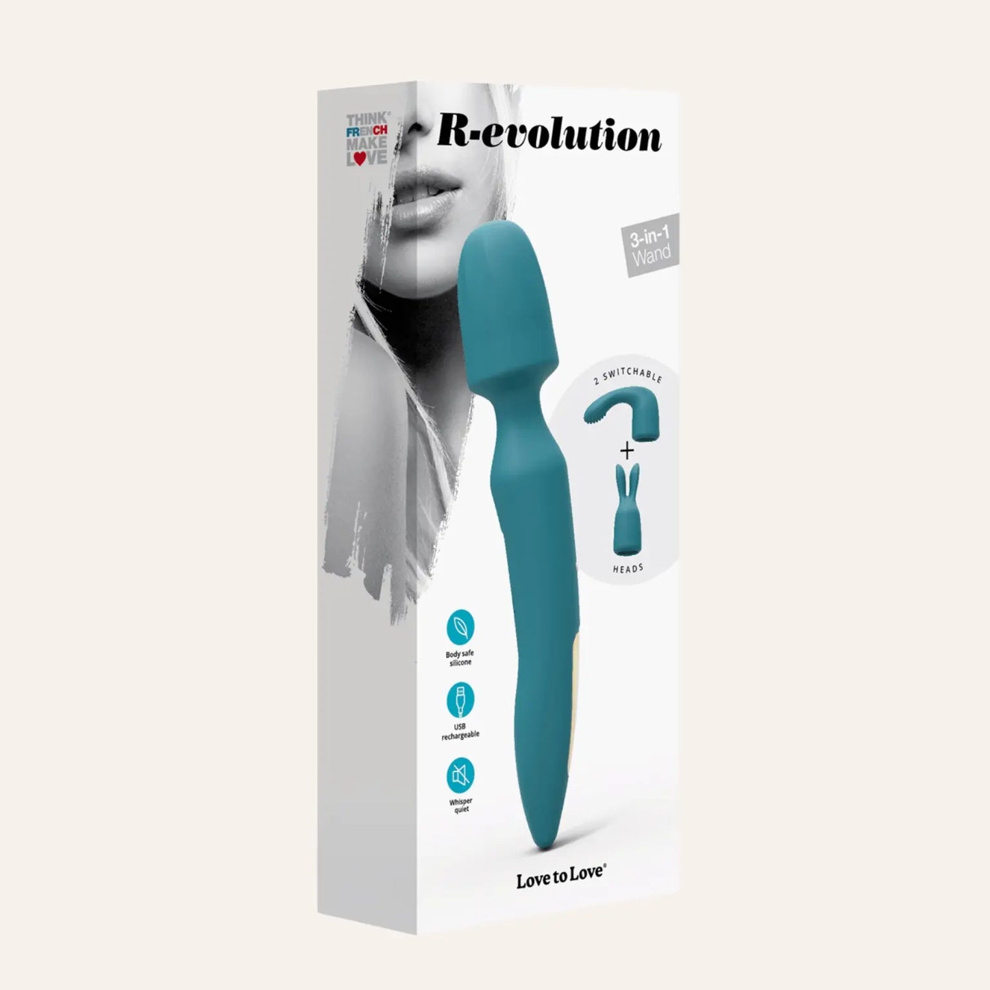 Emballage du stimulateur 3-en-1 Wand R-evolution de la marque Love to Love, avec une image de l'appareil et de ses deux têtes interchangeables.
