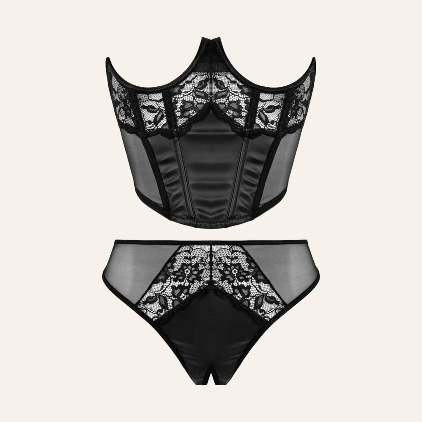 Ensemble de lingerie noire comprenant un bustier en dentelle et un string assorti, présenté sur un fond neutre.