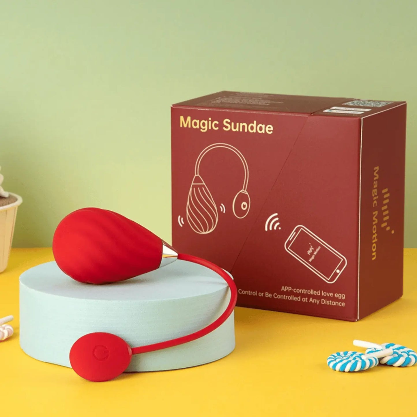 Œuf vibrant connecté Magic Sundae en rouge avec sa boîte, disponible chez Oh My God'Z. Ce sextoy de haute qualité est conçu pour être contrôlé via une application mobile, offrant une stimulation personnalisée à distance.