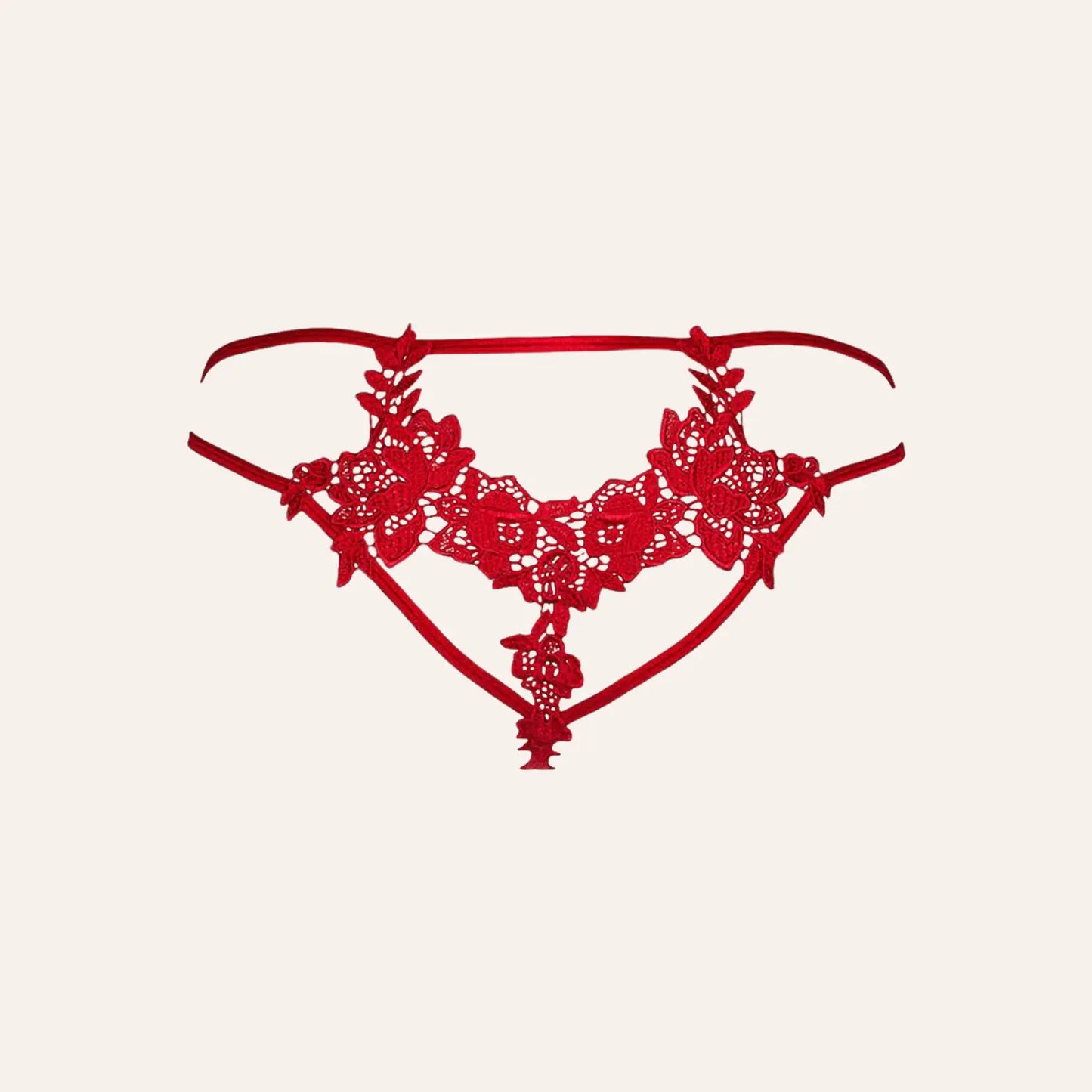 String rouge V-8868 par Axami présenté en gros plan, avec des broderies florales exquises. Disponible sur la boutique Oh My God'Z, cette lingerie luxueuse est idéale pour un style sexy et sophistiqué.