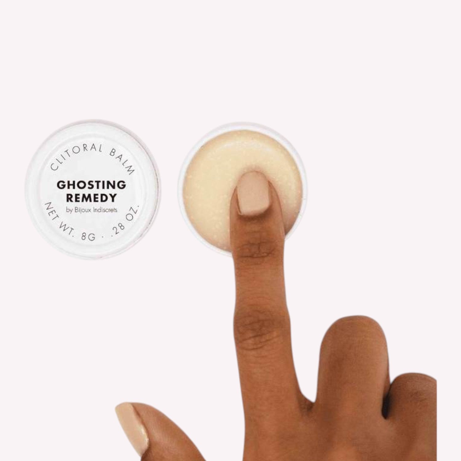 Baume clitoridien Ghosting Remedy dans pot blanc ouvert avec doigt appliquant texture creme beige - Oh My God'Z