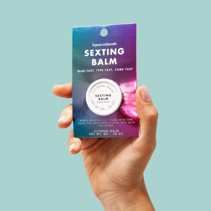 Packaging du baume orgasmique Sexting Balm Clitherapy, pot blanc sur carte bleue et rose - Oh My God'Z