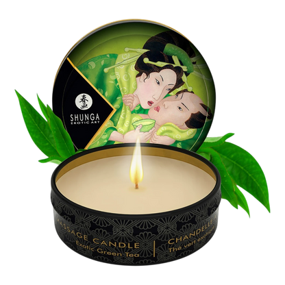 Bougie de massage Shunga thé vert exotique, boîte noire et or ouverte avec cire beige et feuilles vertes - Oh My God'Z