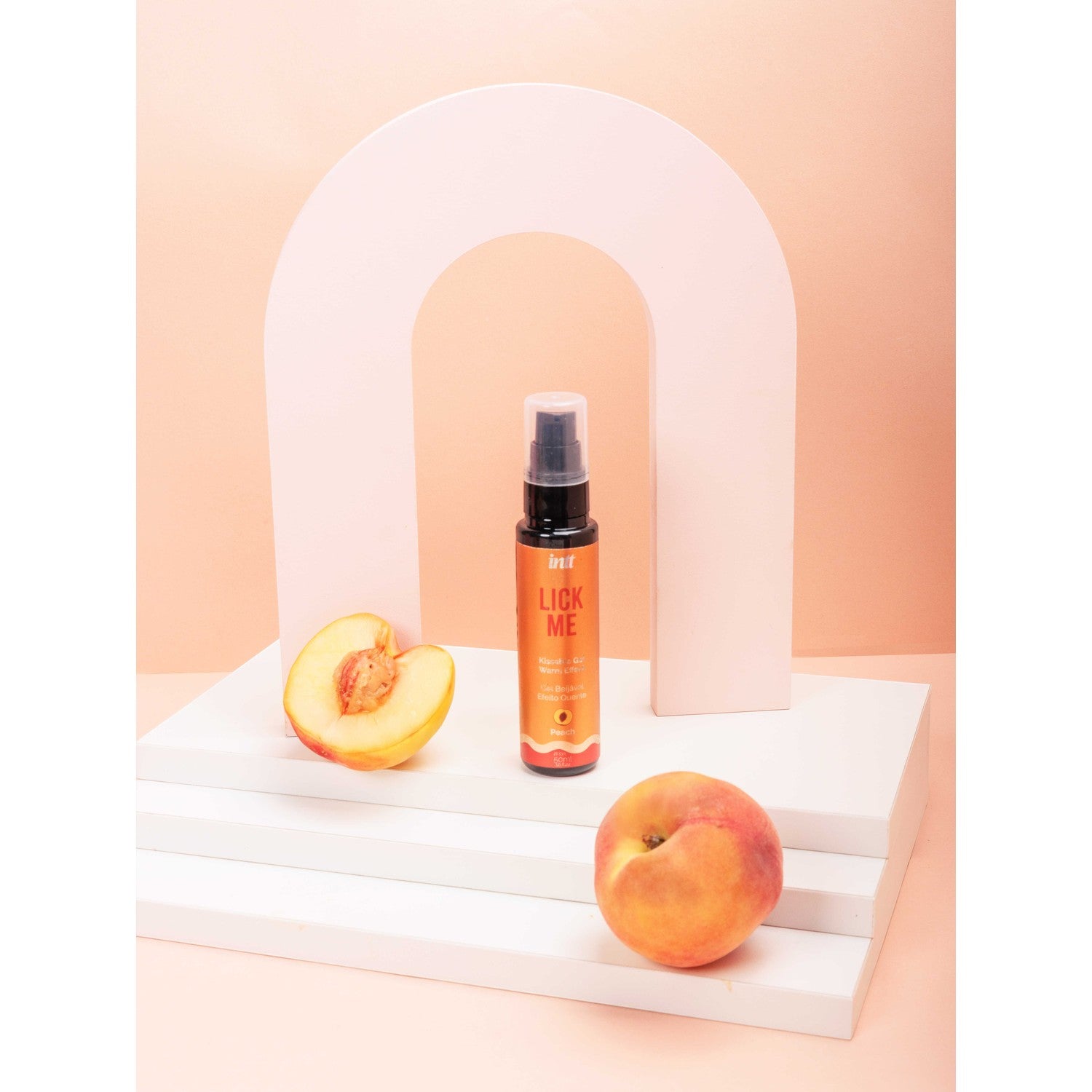 Gel chauffant embrassable Lick Me saveur pêche en flacon orange avec pompe et fruits - Oh My God'Z