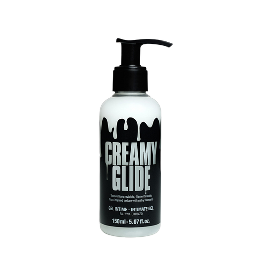 Gel intime Creamy Glide coulant en filaments lactés sur jambe en collant noir - Oh My God'Z
