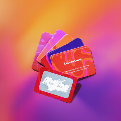 Cartes Glimmers colorées en éventail avec message I love you gratté sur fond dégradé rose et orange - Oh My God'Z