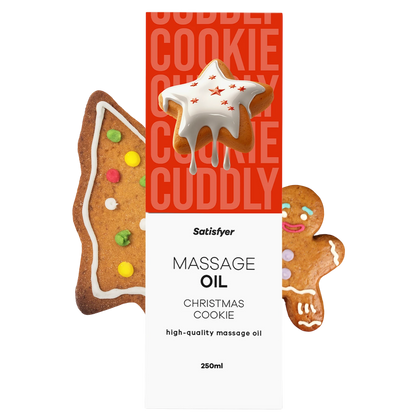 Huile de massage Christmas Cookie 250 ml Satisfyer avec biscuits décorés sur fond rouge festif - Oh My God'Z