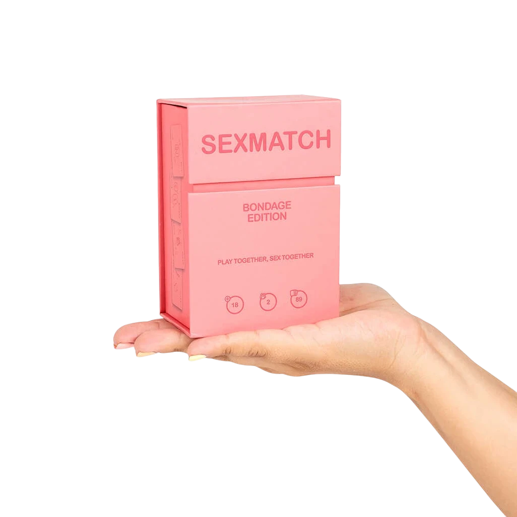 Main tenant le boîtier rose du jeu Sexmatch Bondage Edition format compact - Oh My God'Z