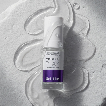 Flacon verre Mixgliss Play stimulant point G 30 ml entoure de gel lubrifiant transparent sur fond blanc - Oh My God'Z