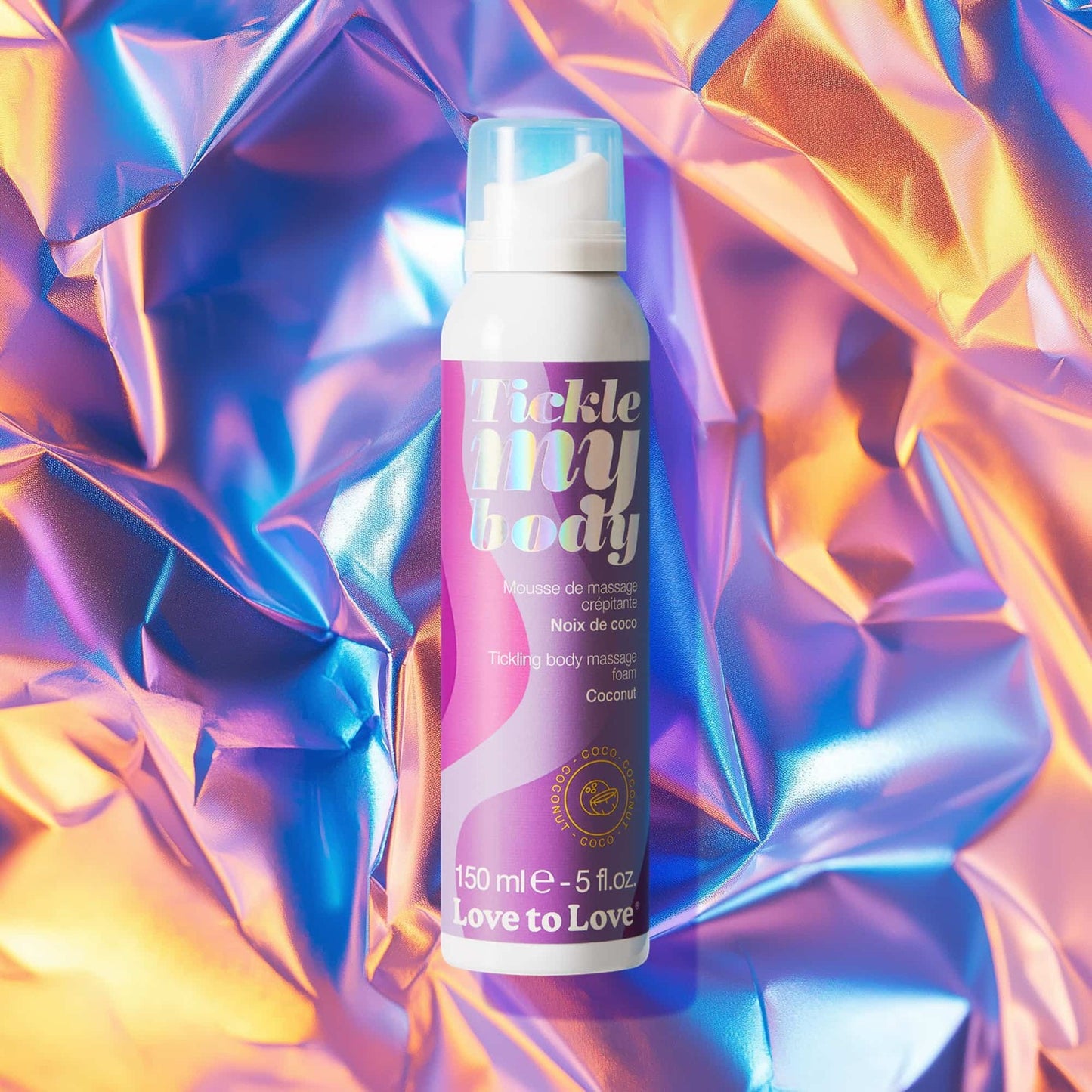 Mousse crépitante Tickle My Body coconut sur fond holographique irisé, packaging rose et violet - Oh My God'Z